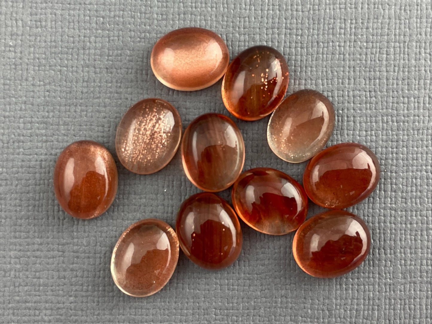 10x7 or 10x8 Oregon Sunstones Oval Cabochon with Schiller | Per Stone - Oregon Sunstone - Gem Enthusiast