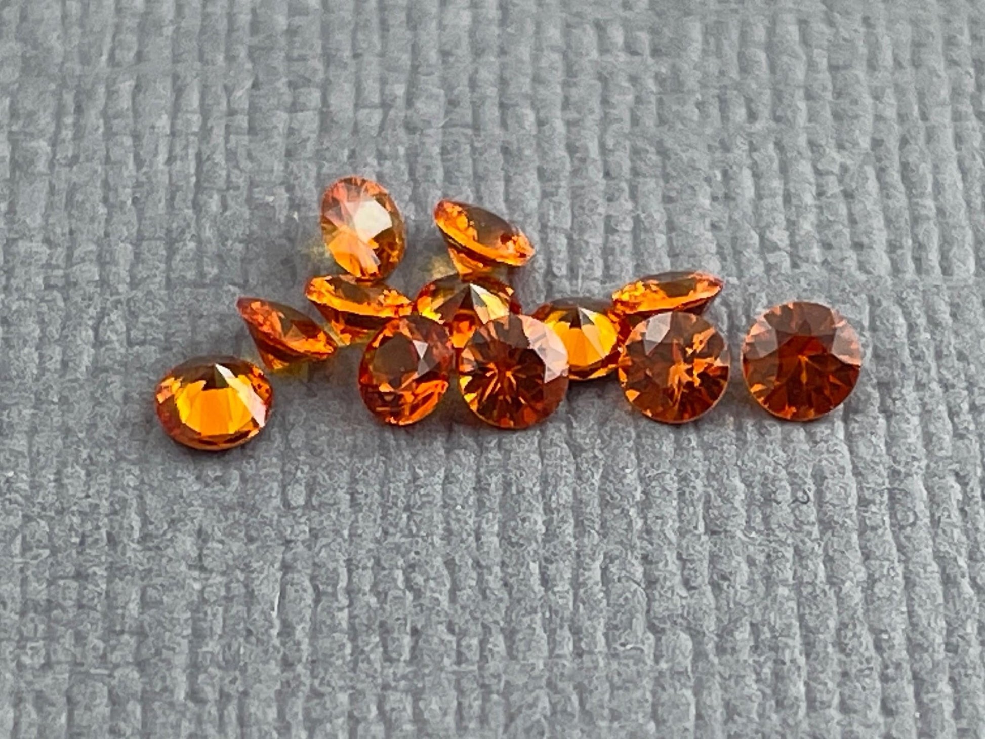 2.5mm Spessartine Garnet Round | Per Stone | Mandarin Orange - Gem Enthusiast