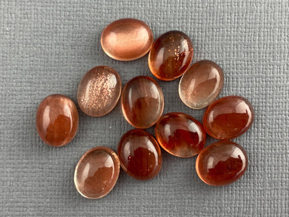 10x7 or 10x8 Oregon Sunstones Oval Cabochon with Schiller | Per Stone - Oregon Sunstone - Gem Enthusiast