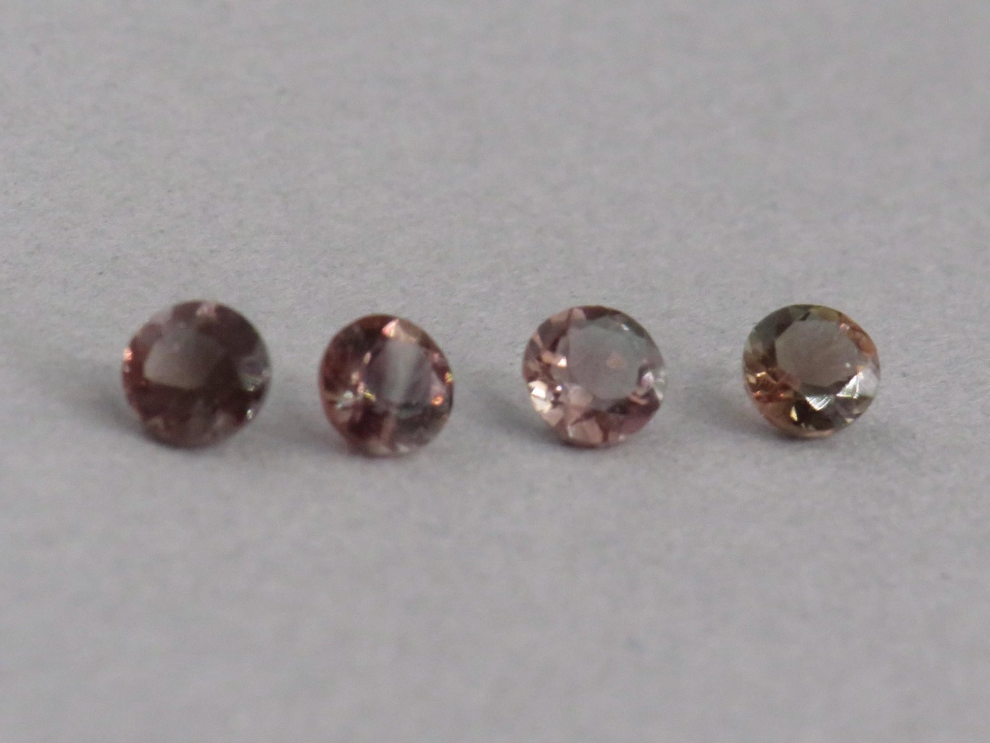 4mm Oregon Sunstone Lot | Red with Zoning and Striations | Faceted Round Gemstones | OSF247 - Gem Enthusiast