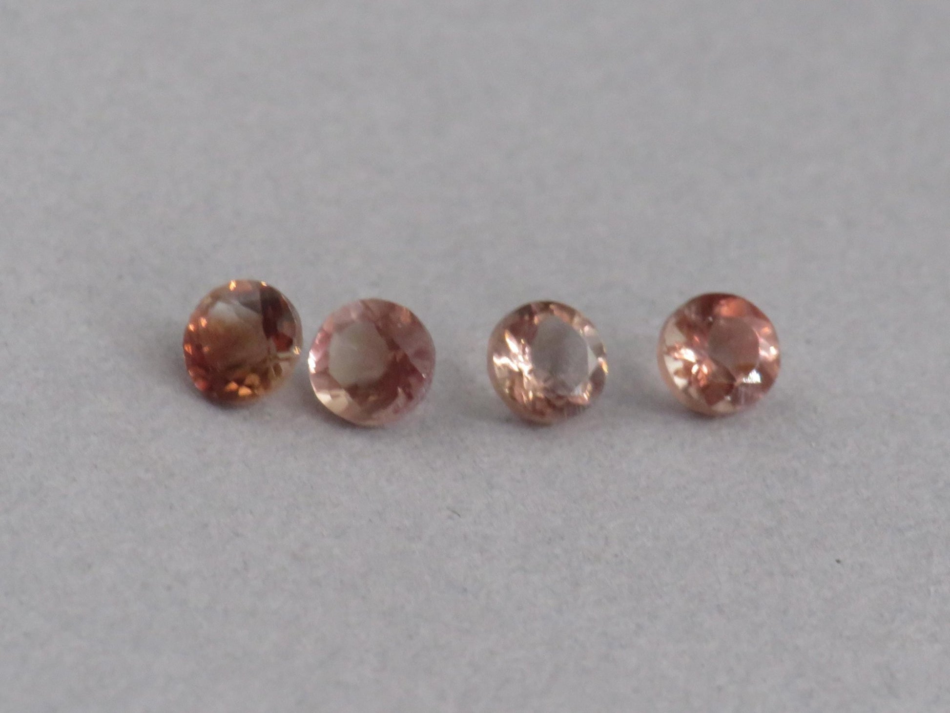 4mm Oregon Sunstone Lot | Red with Zoning and Striations | Faceted Round Gemstones | OSF248 - Gem Enthusiast