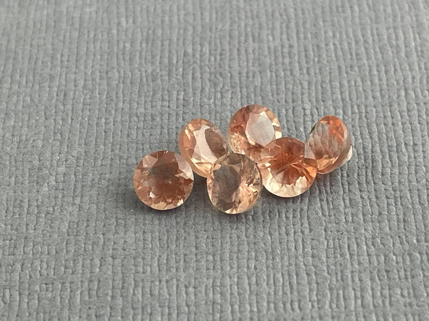 5mm Oregon Sunstones Faceted Round Gemstones | Medium, Light, Bi - color - Gem Enthusiast