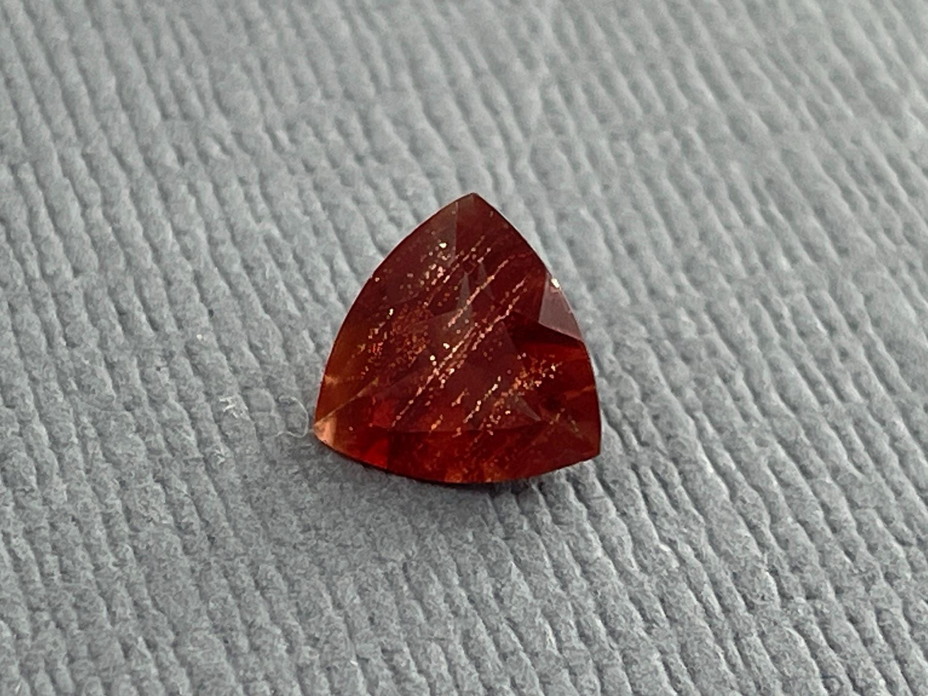 7mm Red Oregon Sunstone Trillion Gemstone with Schiller | .9 carats | OSF170 - Oregon Sunstone - Gem Enthusiast