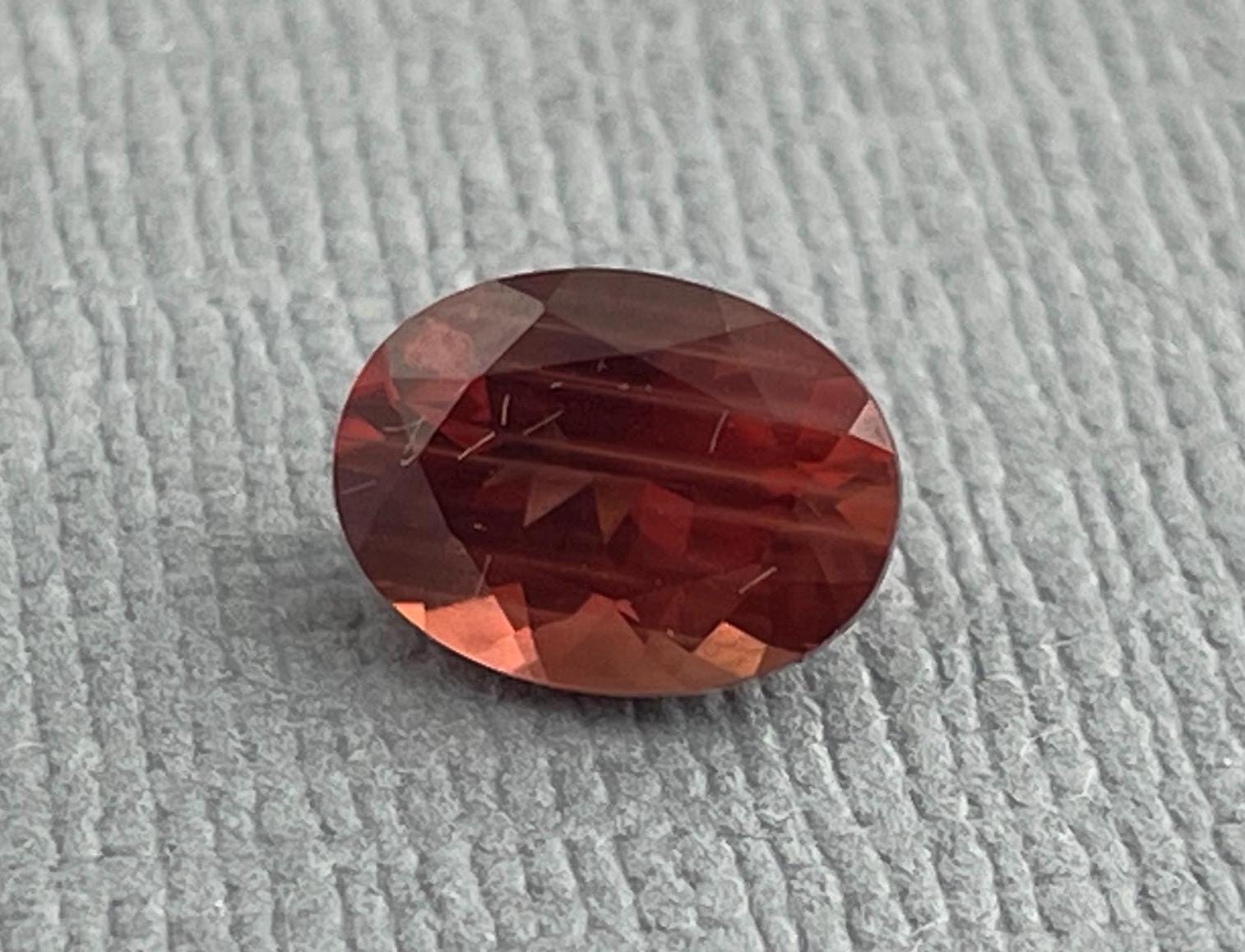 8x6 Red Oregon Sunstone Oval Faceted Gemstone | 1.12 carats | OSF180 - Oregon Sunstone - Gem Enthusiast