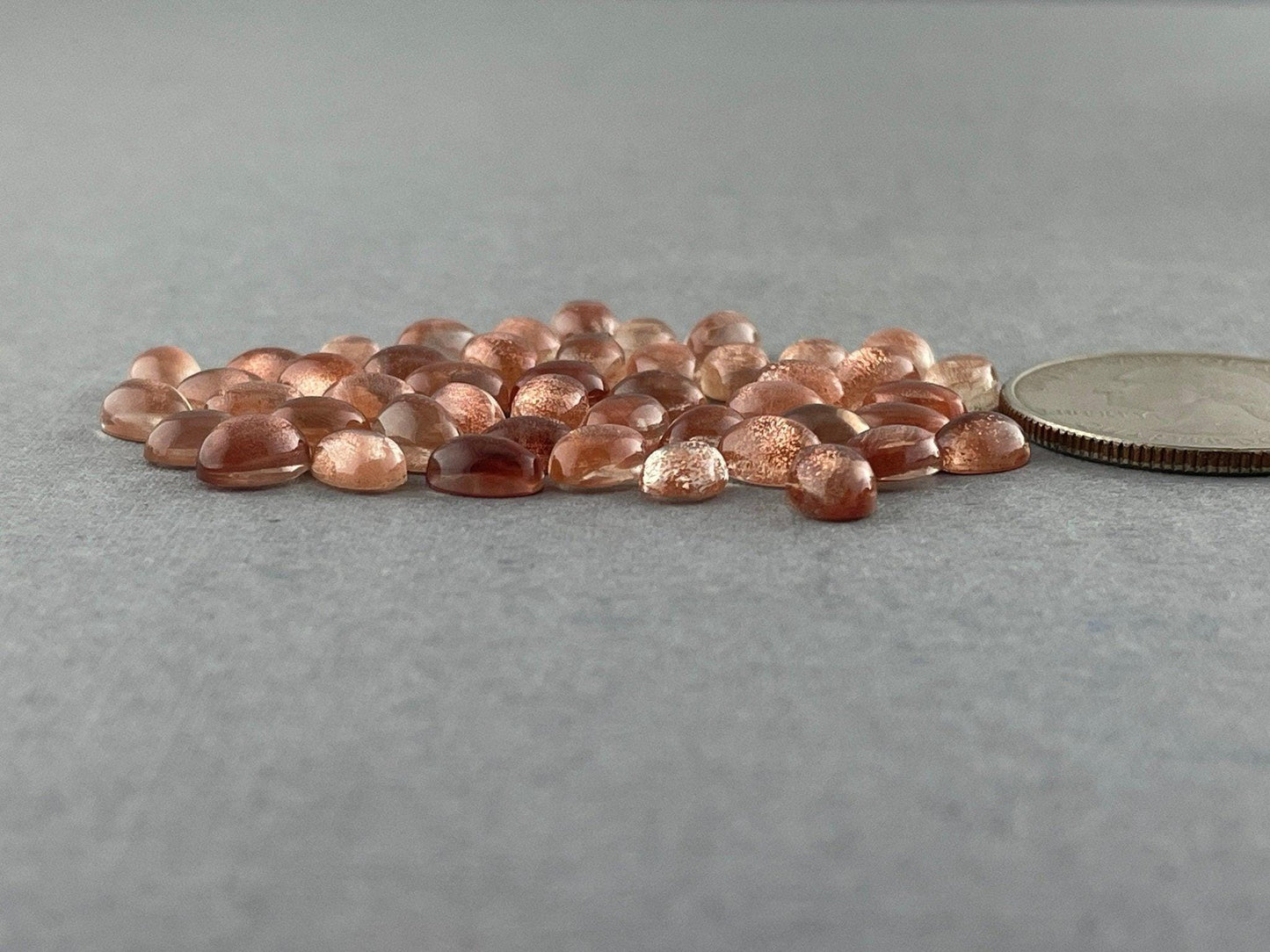 8x6 7x5 6x4 Oregon Sunstones Oval Cabochons with Schiller | Per Stone - Oregon Sunstone - GemEnthusiast