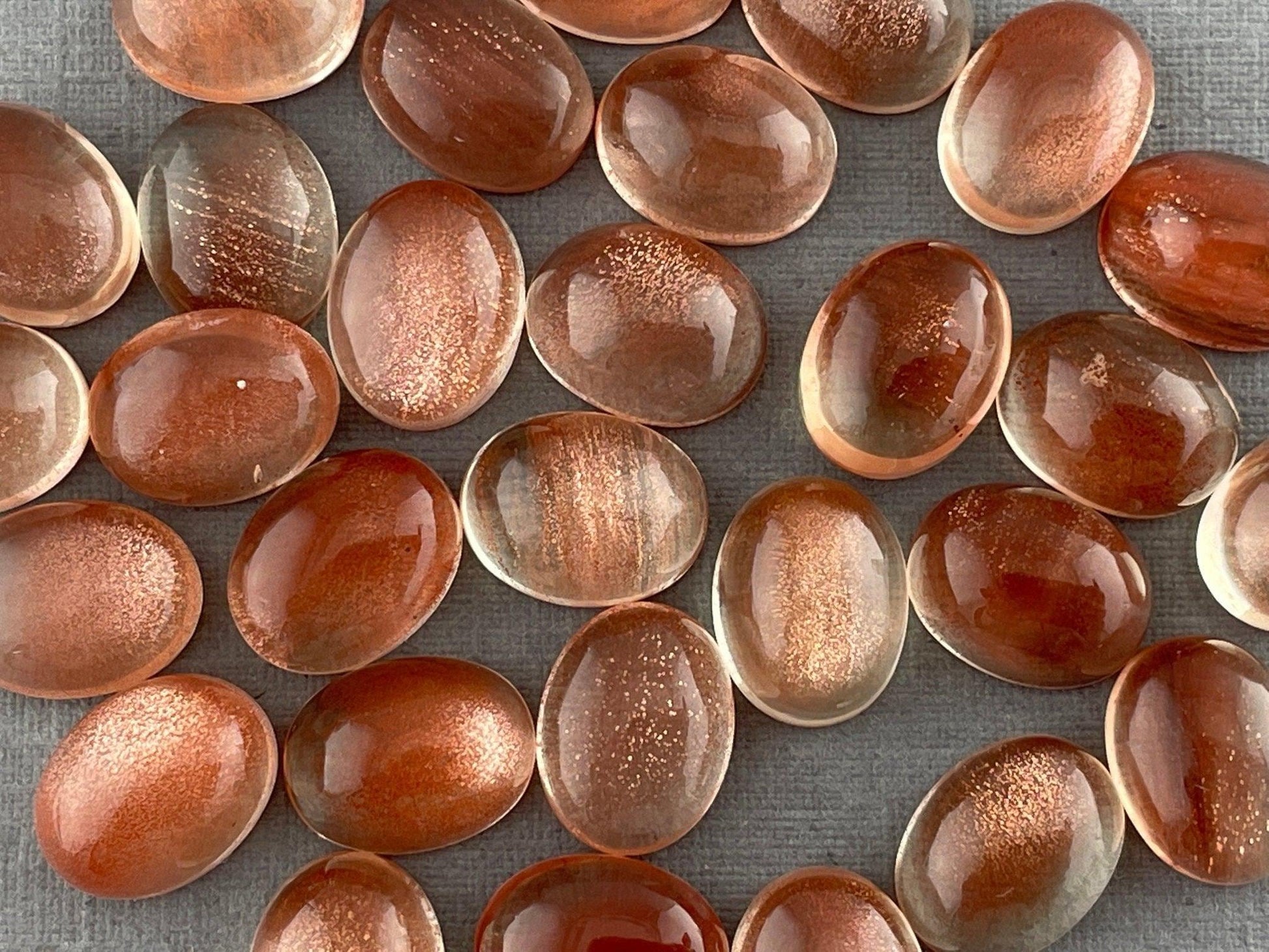 10x8 or 9x7 Oregon Sunstones Oval Cabochon with Schiller | Per Stone - Oregon Sunstone - GemEnthusiast