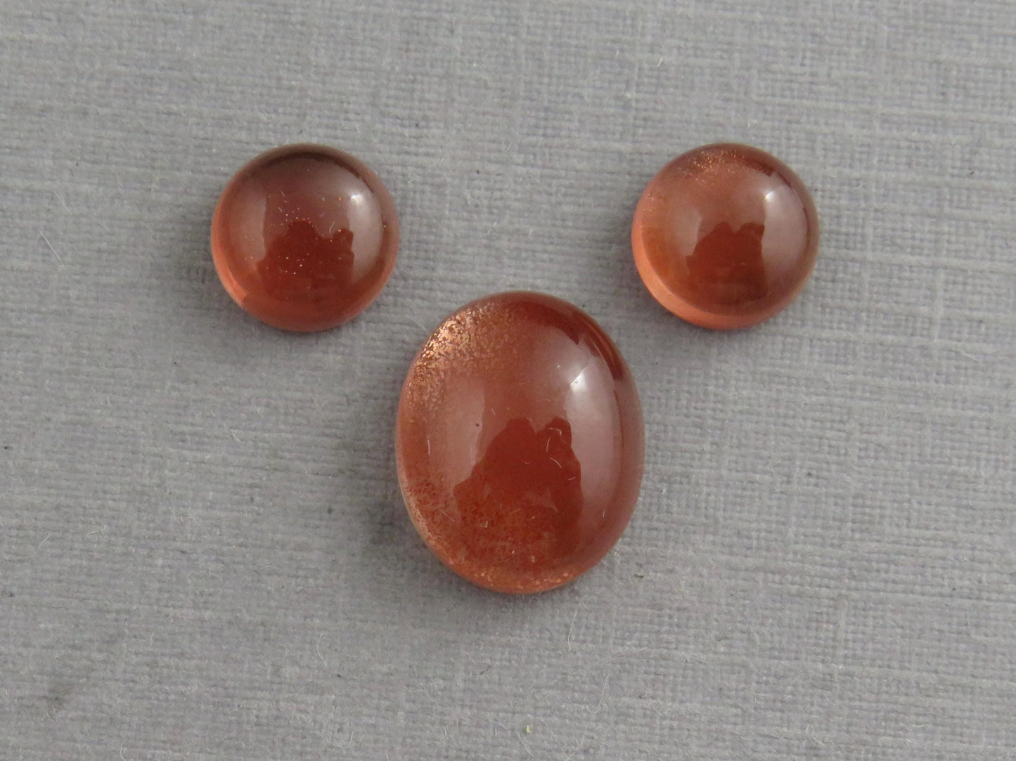 Oregon Sunstones Oval Cabochon Set | 7x7 pair and 11x9 single | 7+ carats | OSC332 - Oregon Sunstone - GemEnthusiast