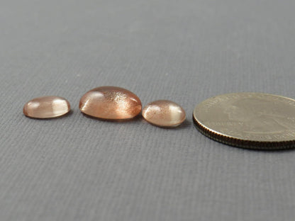 Oregon Sunstones Oval Cabochon Set | 9x7 pair and 12x9 single | 7.13 carats | OSC330 - Oregon Sunstone - GemEnthusiast
