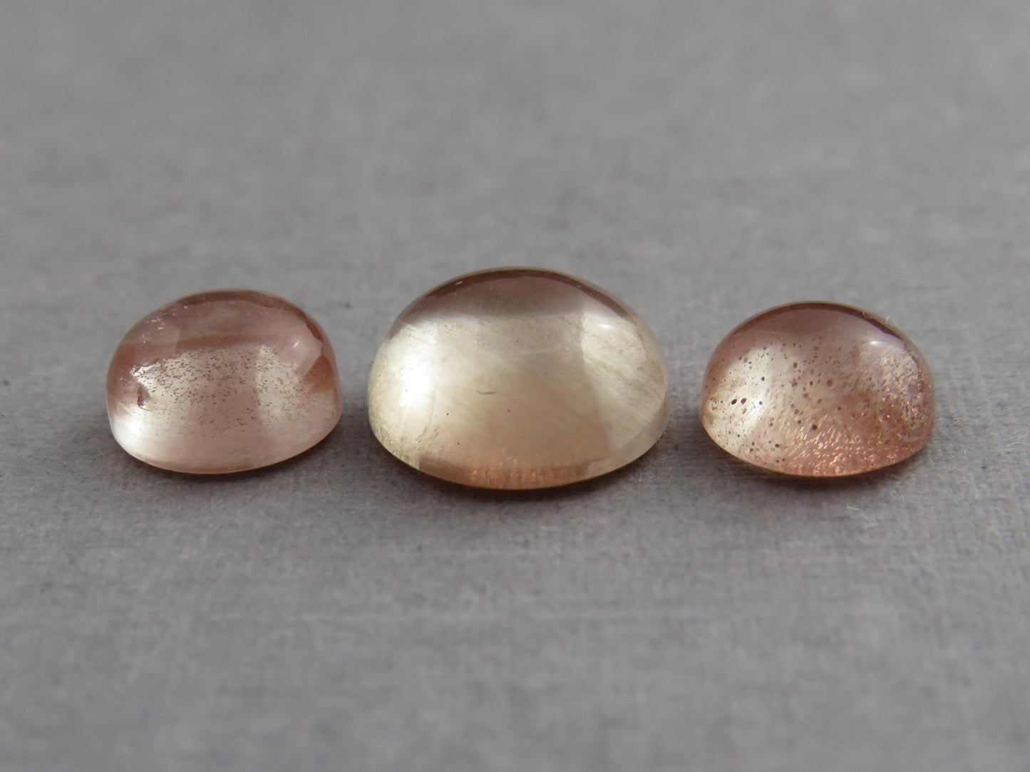 Oregon Sunstones Cabochon Set | 7mm pair and 9mm single Round Gemstones | 5.7 carats | OSC331 - Oregon Sunstone - GemEnthusiast