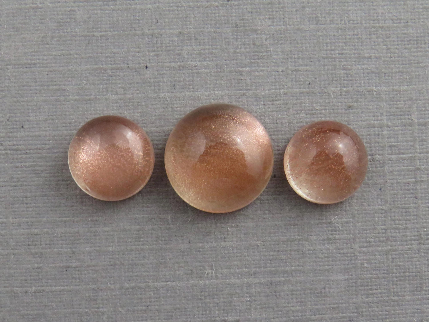 Oregon Sunstones Cabochon Set | 7mm pair and 9mm single Round Gemstones | 5.7 carats | OSC331 - Oregon Sunstone - GemEnthusiast