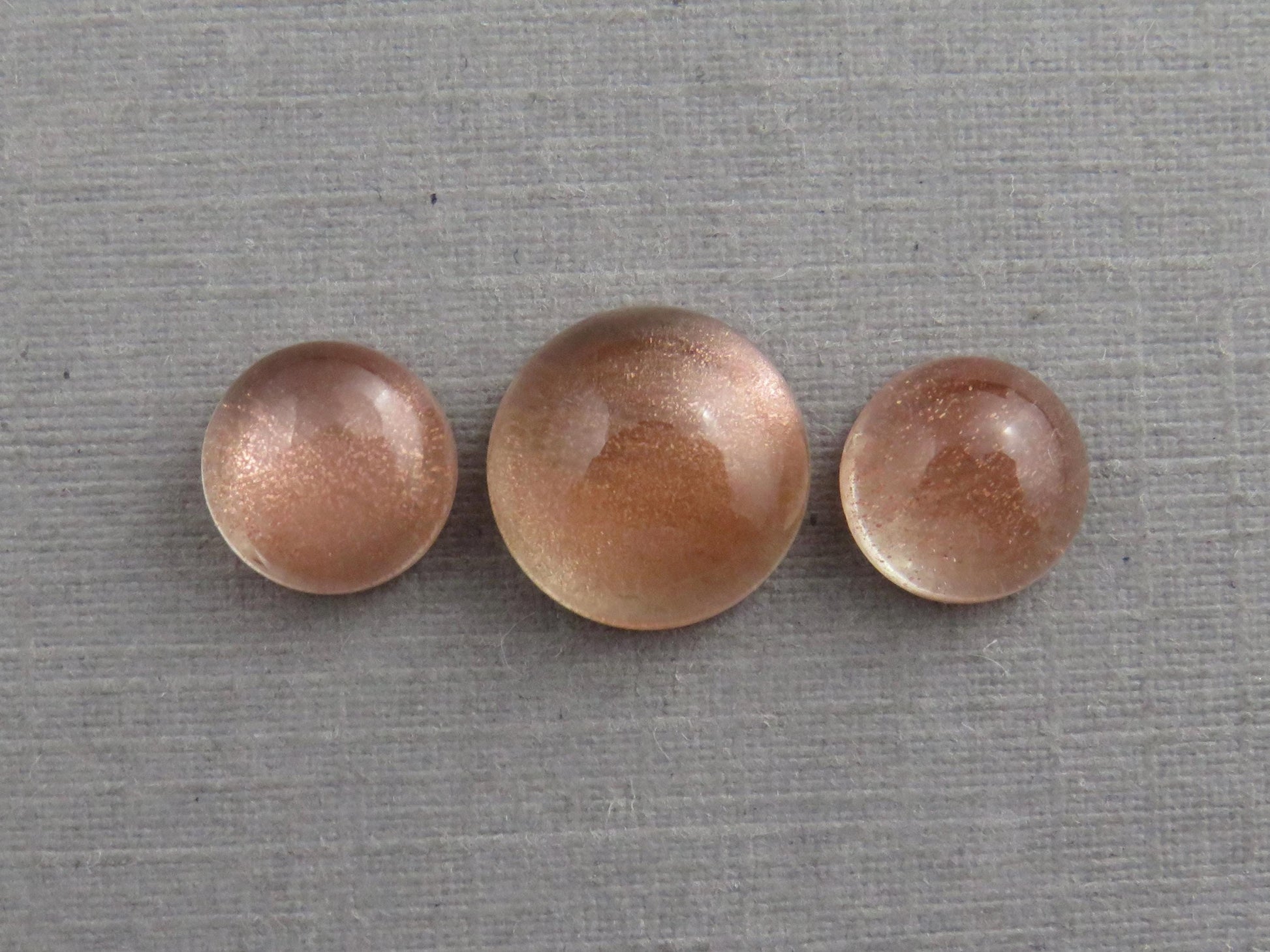 Oregon Sunstones Cabochon Set | 7mm pair and 9mm single Round Gemstones | 5.7 carats | OSC331 - Oregon Sunstone - GemEnthusiast