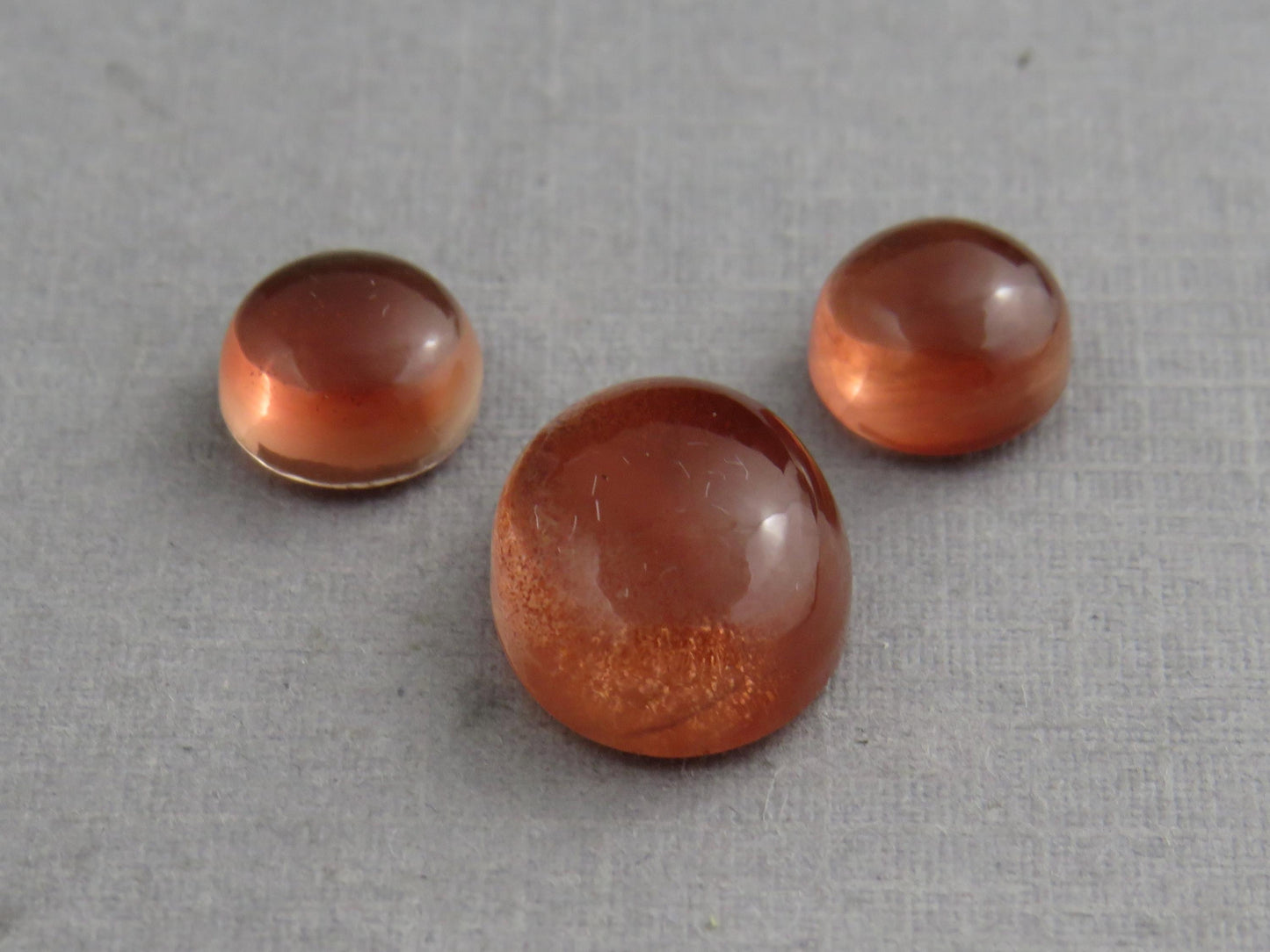 Oregon Sunstones Oval Cabochon Set | 7x7 pair and 11x9 single | 7+ carats | OSC332 - Oregon Sunstone - GemEnthusiast