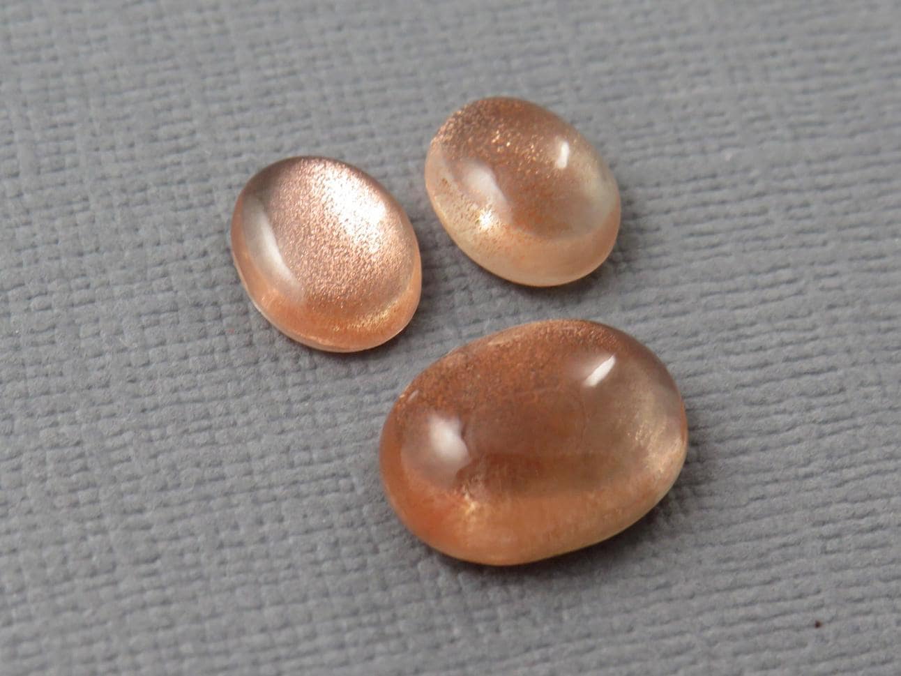 Oregon Sunstones Oval Cabochon Set | 9x7 pair and 12x9 single | 7.13 carats | OSC330 - Oregon Sunstone - GemEnthusiast
