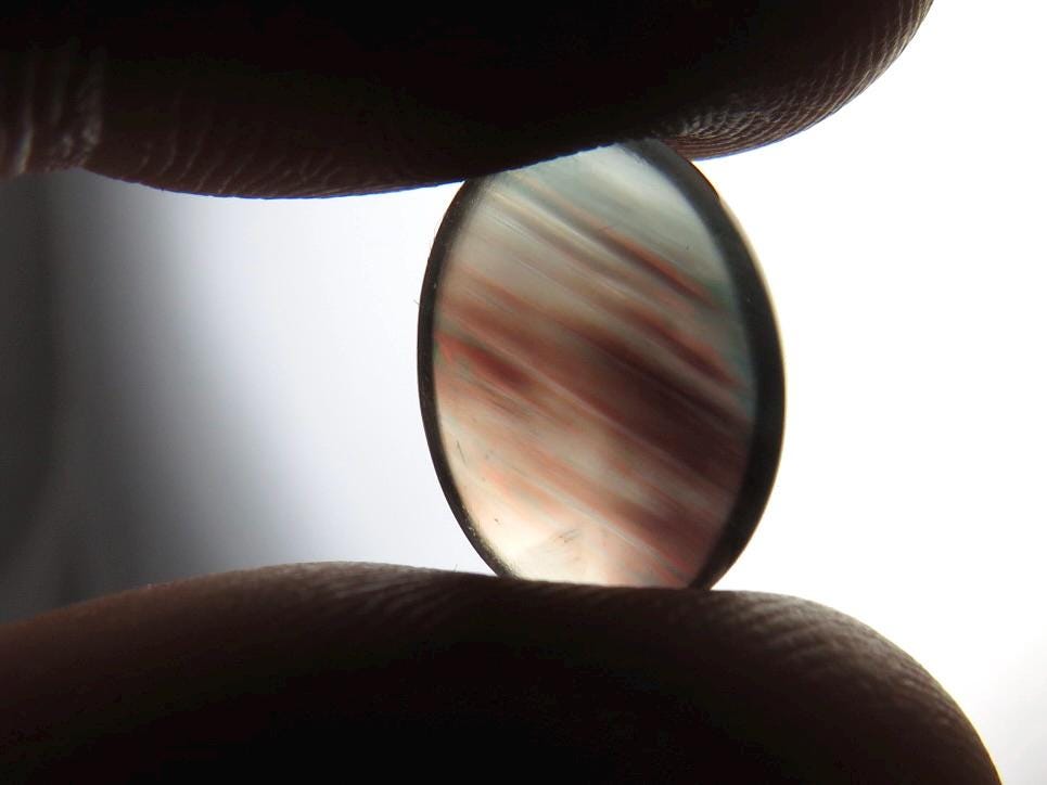 Bicolor Oregon Sunstone with Red and Green | 14x10mm Oval Cabochon | 6.14 carats | OSC338 - Oregon Sunstone - GemEnthusiast