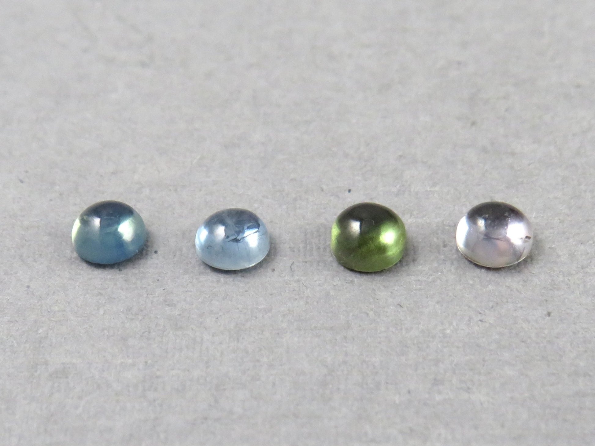 Montana Sapphire Cabochon — 4mm Round | Per Stone | Teal - Blue, Light Blue, Green & Pale Purple | SA305 - One of a Kind Cabochons - Gem Enthusiast