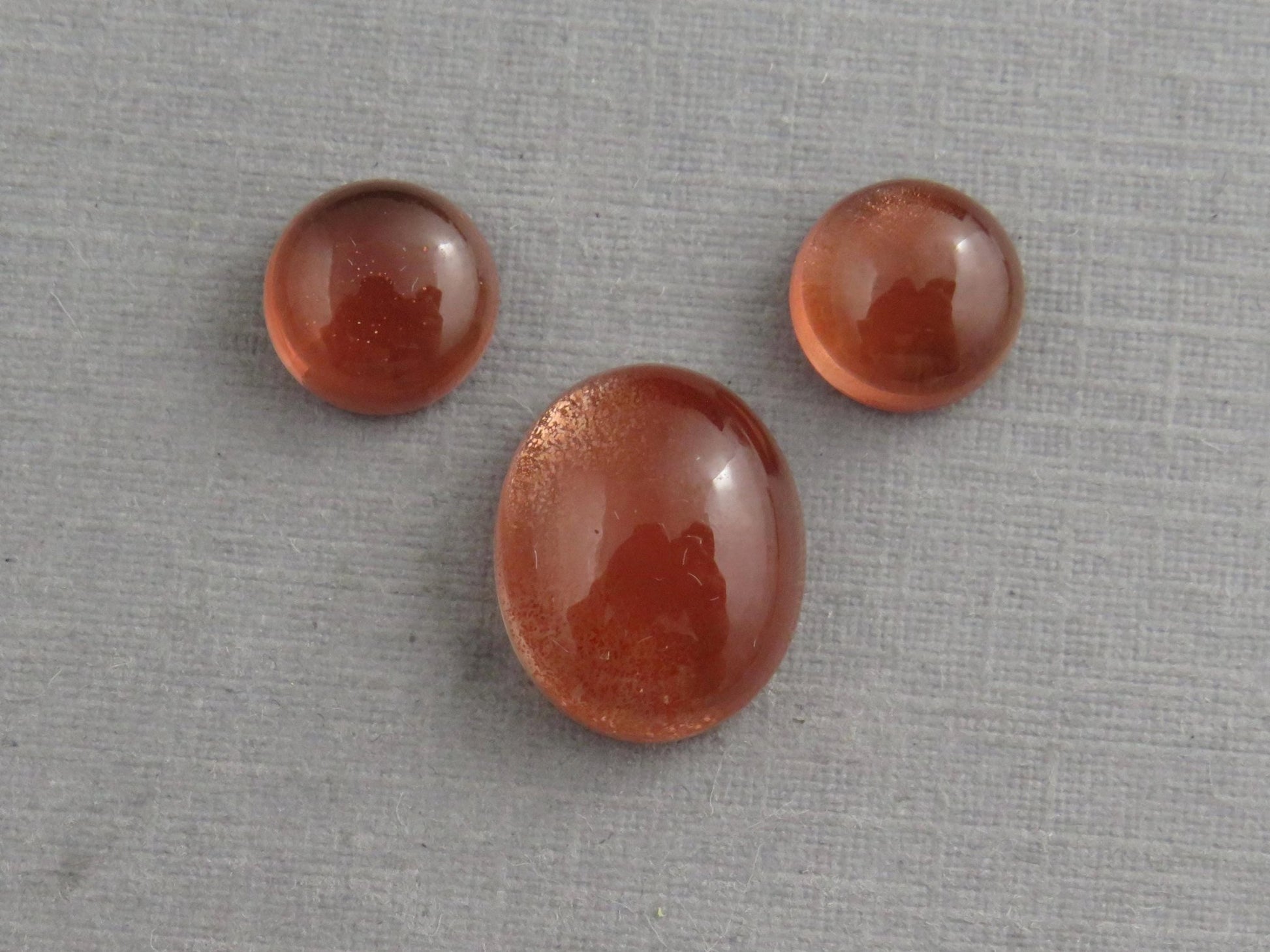 Oregon Sunstones Oval Cabochon Set | 7x7 pair and 11x9 single | 7+ carats | OSC332 - Gem Enthusiast